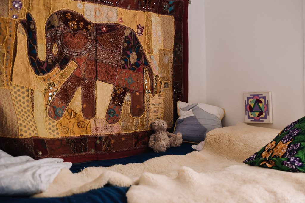 Montessori floor bed with sheepskin in child's bedroom