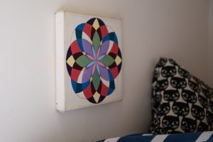 handmade mandala on wall in child's bedroom
