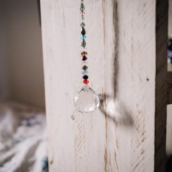 Crystal hanging from shelf in child's bedroom