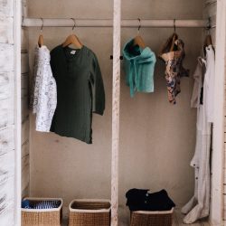Child's wardrobe with limited choice of clothing hanging up